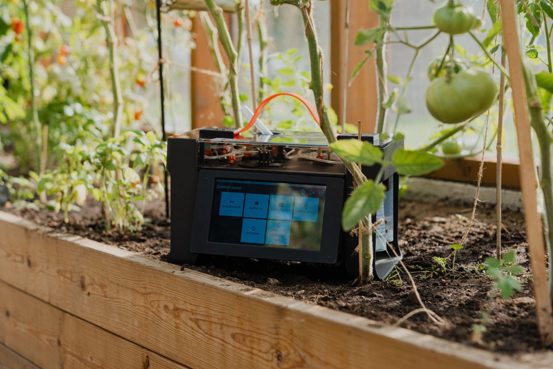 Smagry portable soil analyser in a greenhouse bed